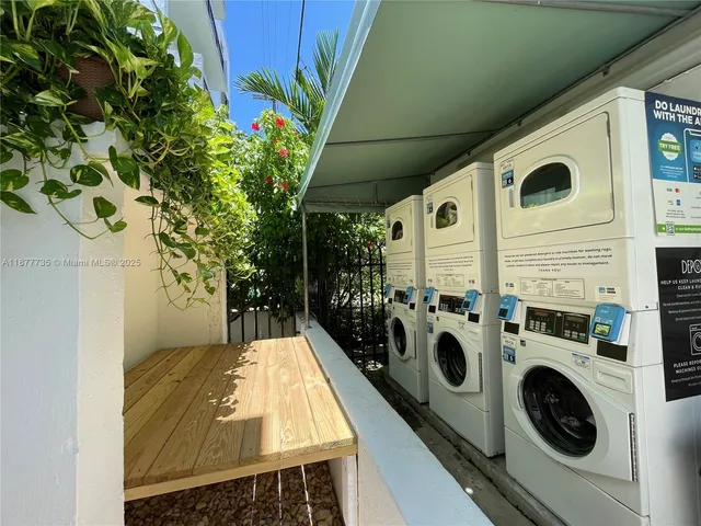 a view of a balcony with washer and dryer