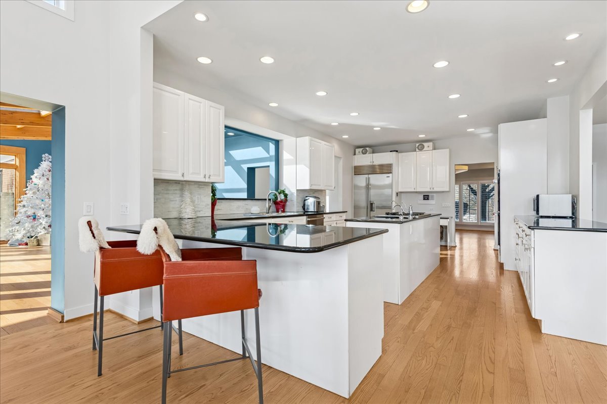 12 East Penny Road South Barrington, IL 60010 - Photo 11 of 61 a kitchen with stainless steel appliances kitchen island granite countertop a sink and a refrigerator