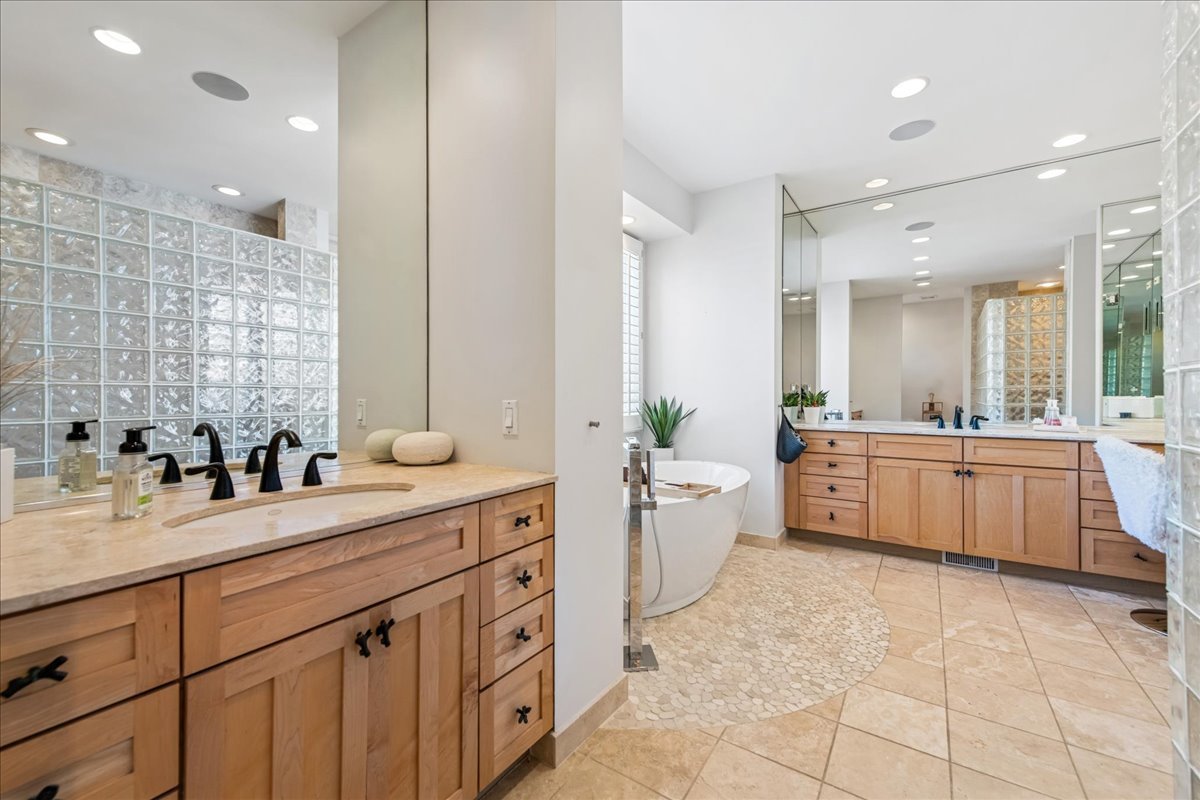 12 East Penny Road South Barrington, IL 60010 - Photo 21 of 61 a large bathroom with a double vanity sink a mirror and a bathtub