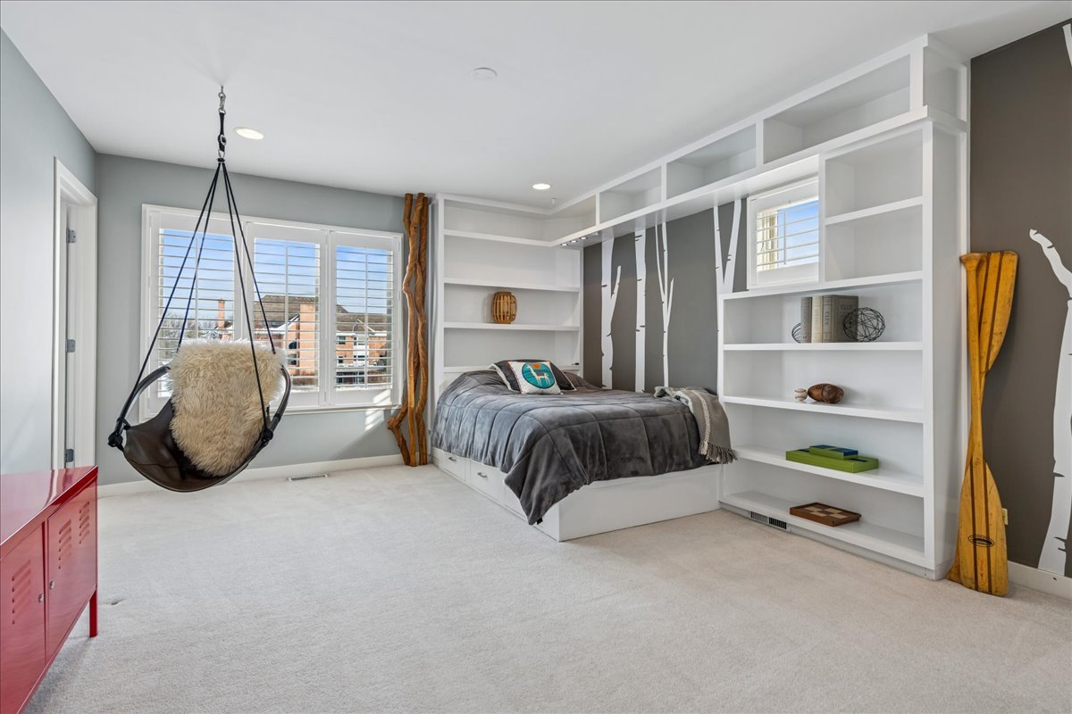 12 East Penny Road South Barrington, IL 60010 - Photo 27 of 61 a bedroom with a bed a large window and wall painting