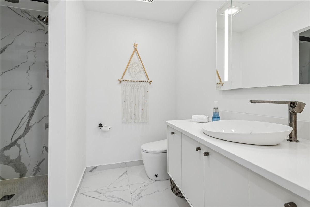 12 East Penny Road South Barrington, IL 60010 - Photo 30 of 61 a bathroom with a sink a toilet and a mirror