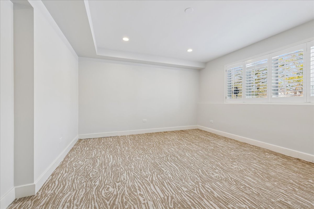 12 East Penny Road South Barrington, IL 60010 - Photo 32 of 61 an empty room with wooden floor and windows