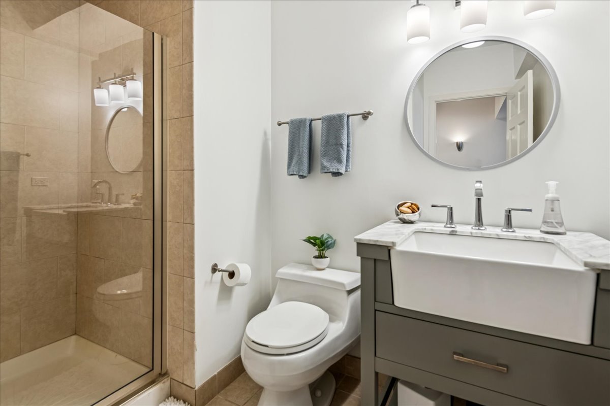 12 East Penny Road South Barrington, IL 60010 - Photo 33 of 61 a bathroom with a sink toilet and shower