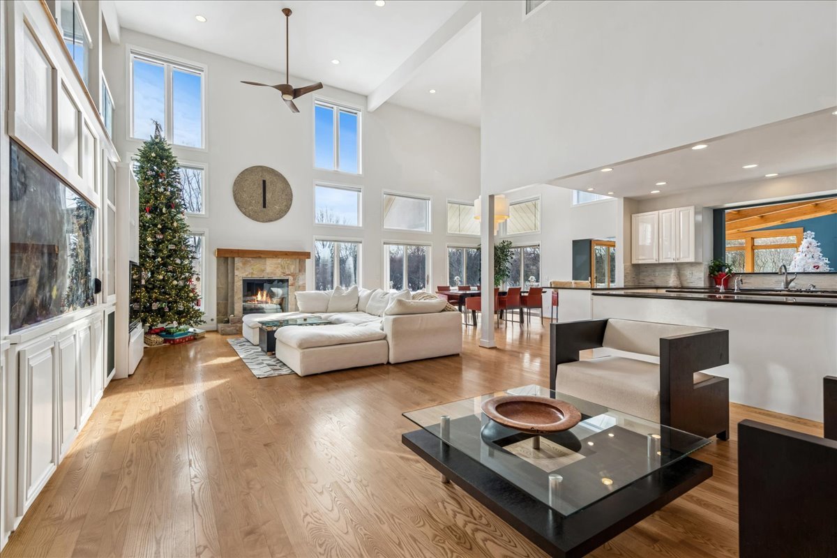 12 East Penny Road South Barrington, IL 60010 - Photo 7 of 61 a living room with furniture kitchen view and a fireplace