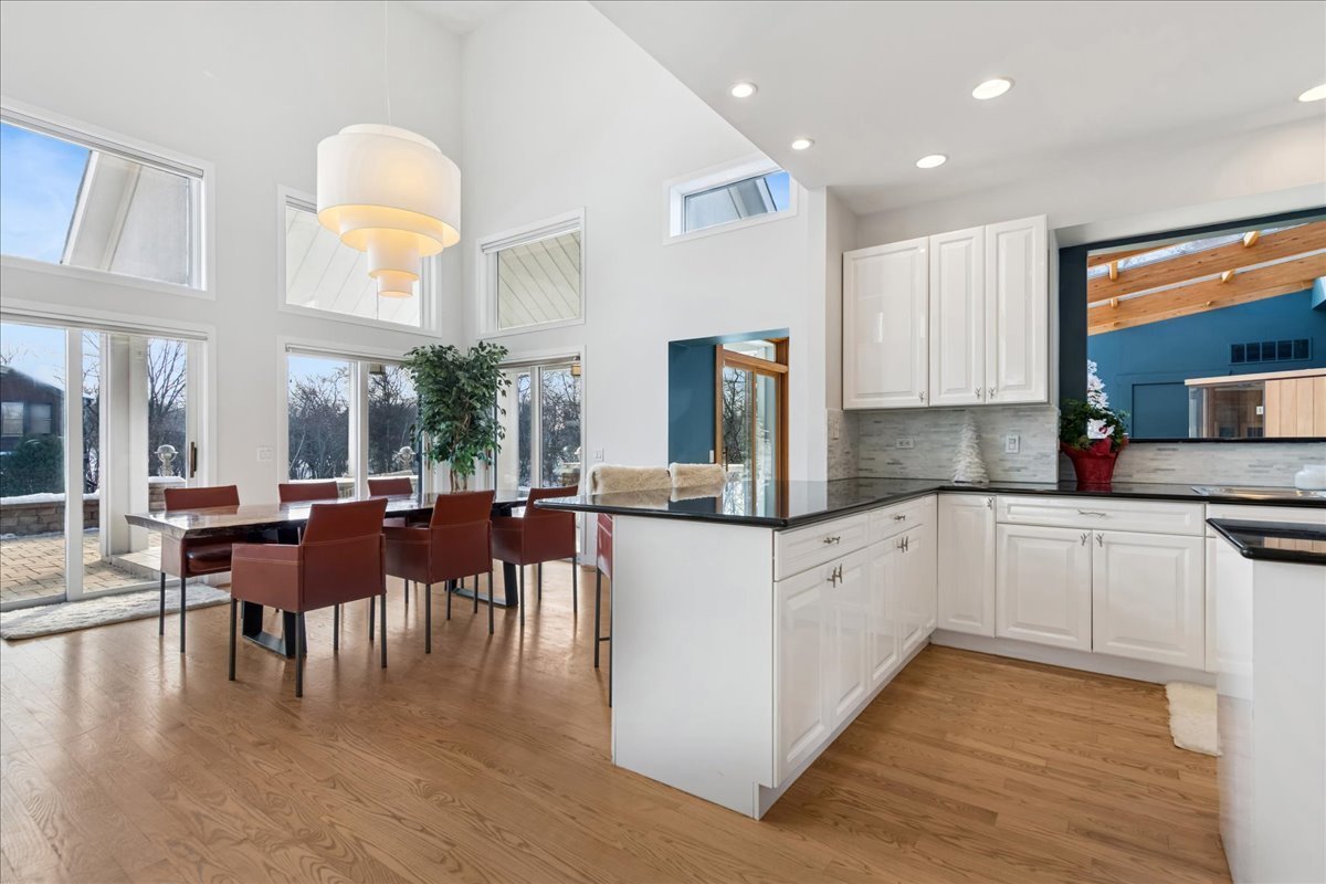 12 East Penny Road South Barrington, IL 60010 - Photo 8 of 61 a kitchen with a white cabinets and chairs