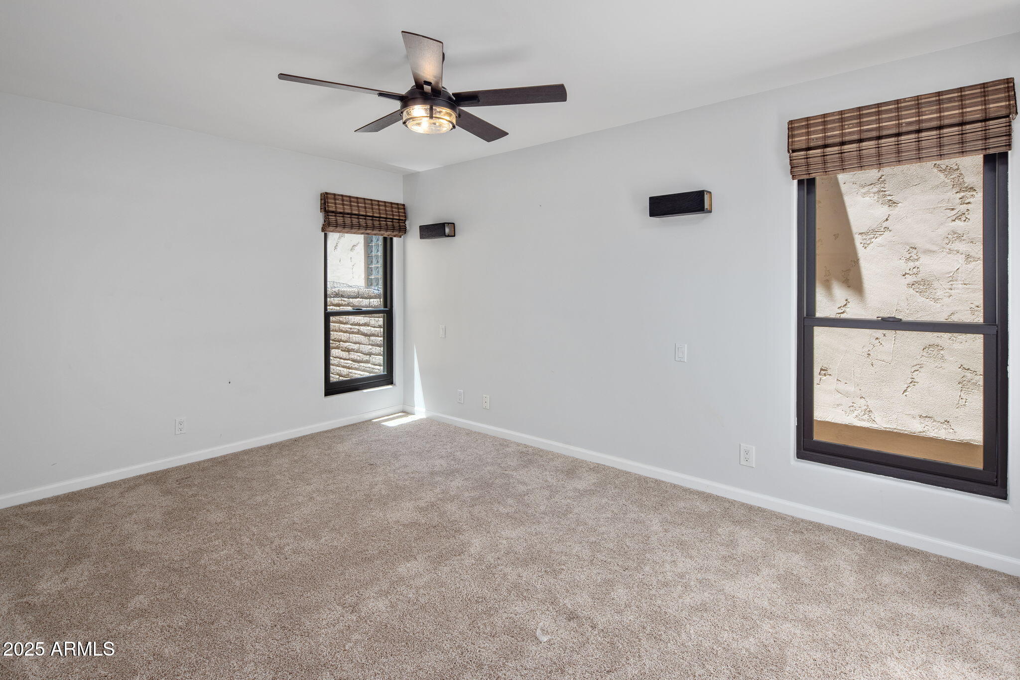 21 West Beryl Avenue Phoenix, AZ 85021 - Photo 17 of 35 an empty room with windows and fan