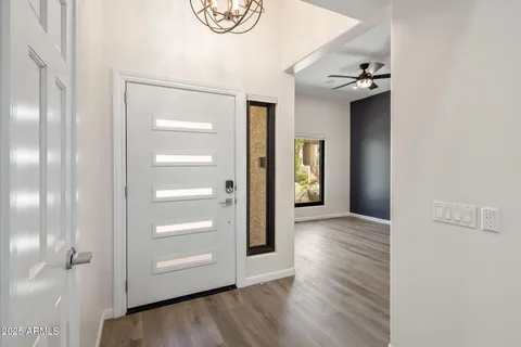 a view of a room with wooden floor