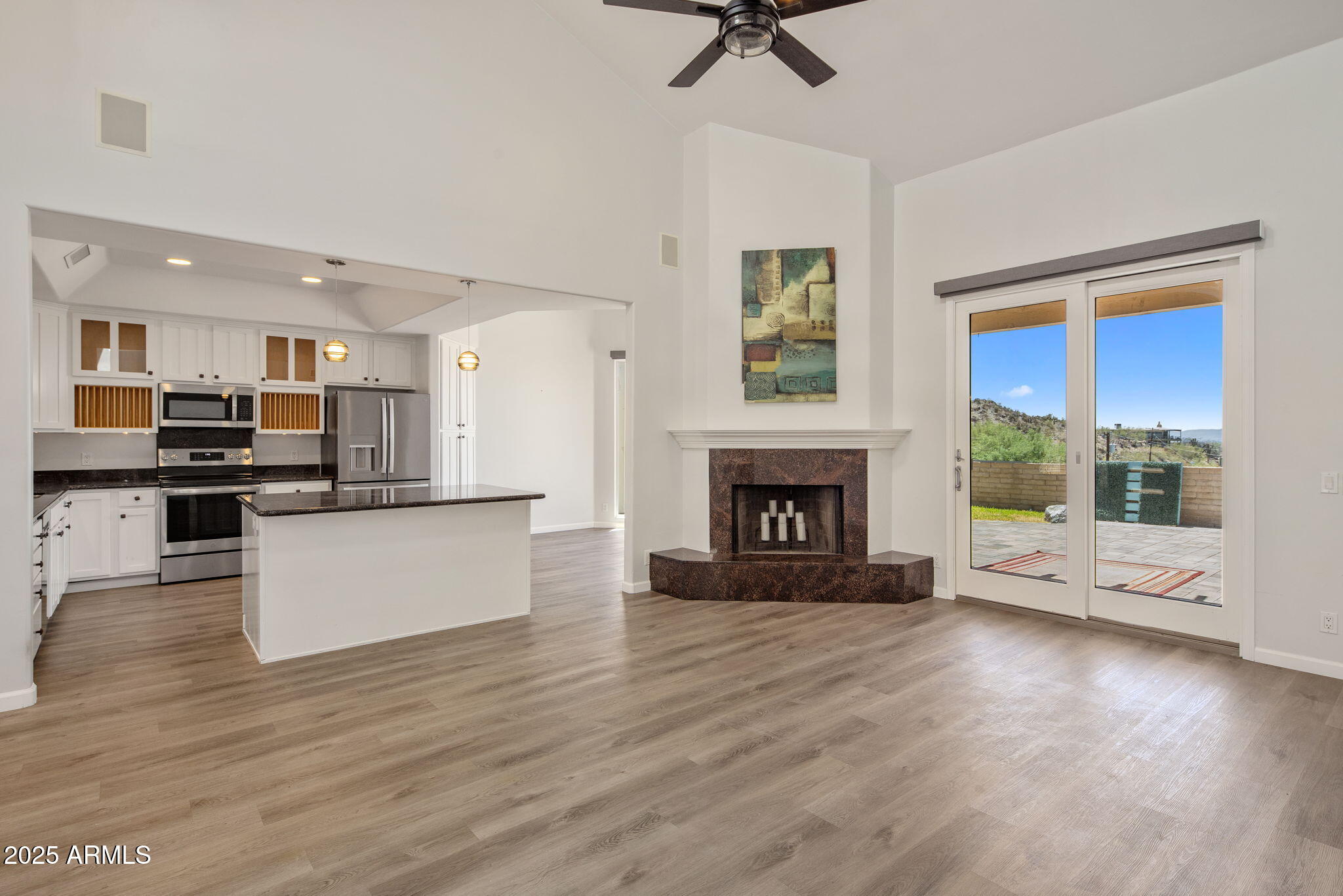 21 West Beryl Avenue Phoenix, AZ 85021 - Photo 5 of 35 a view of an empty room with a kitchen and a fireplace