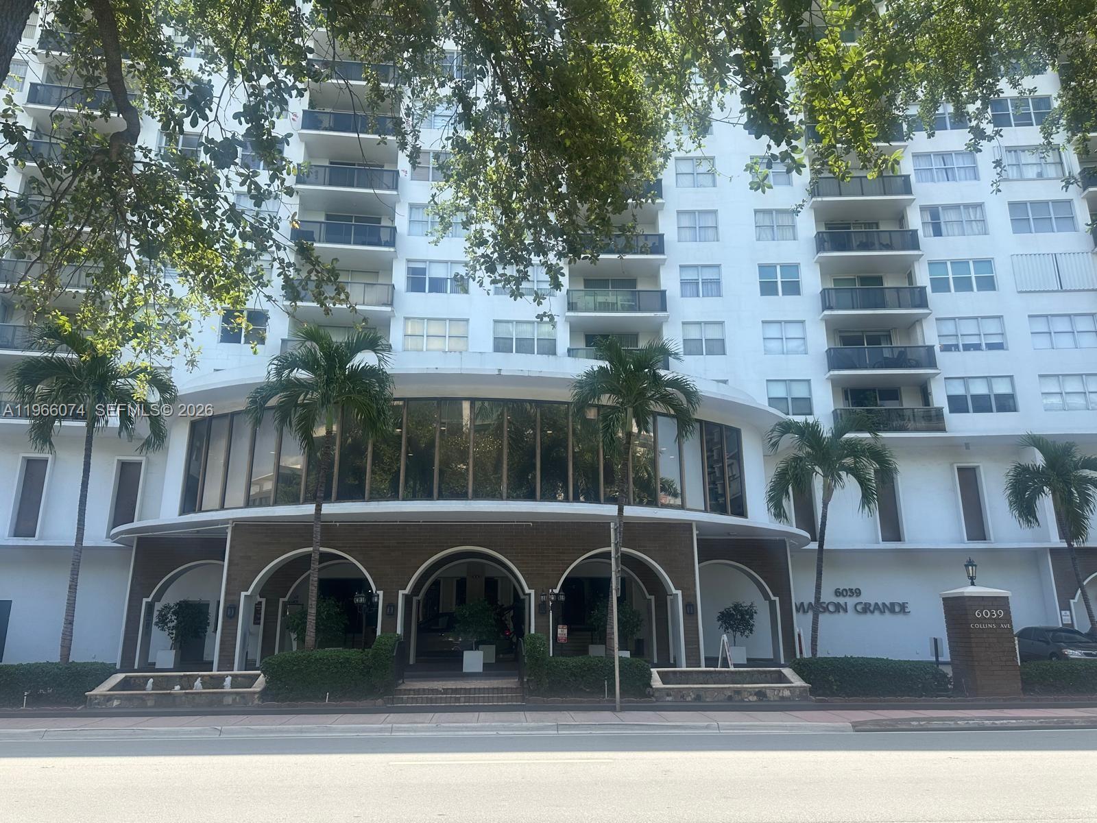 6039 Collins Avenue, Unit 1625 Miami Beach, FL 33140 - Photo 21 of 45 a front view of a building with glass windows