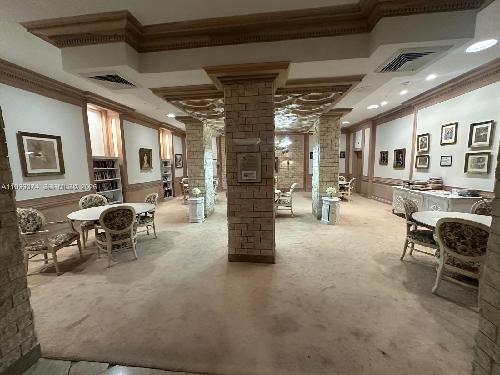 6039 Collins Avenue, Unit 1625 Miami Beach, FL 33140 - Photo 37 of 45 a living room with furniture and a gym machine