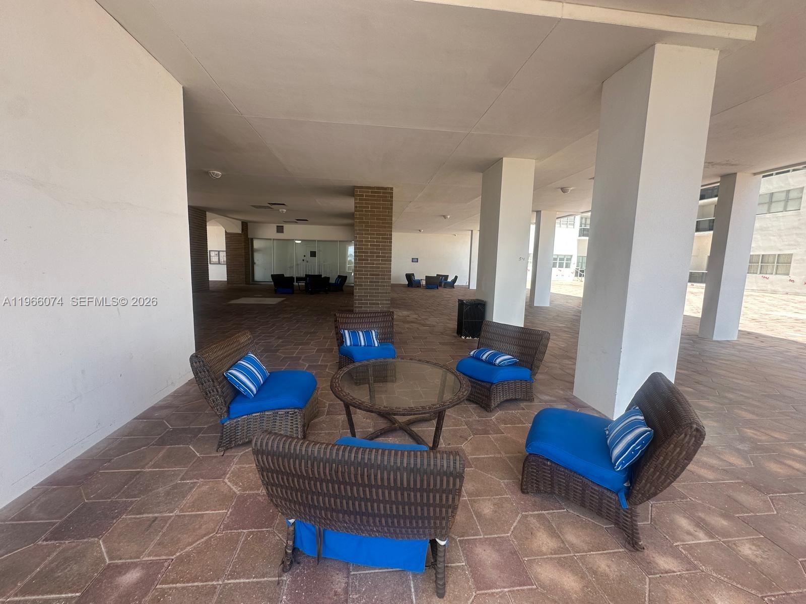 6039 Collins Avenue, Unit 1625 Miami Beach, FL 33140 - Photo 39 of 45 a living room with furniture and a couch