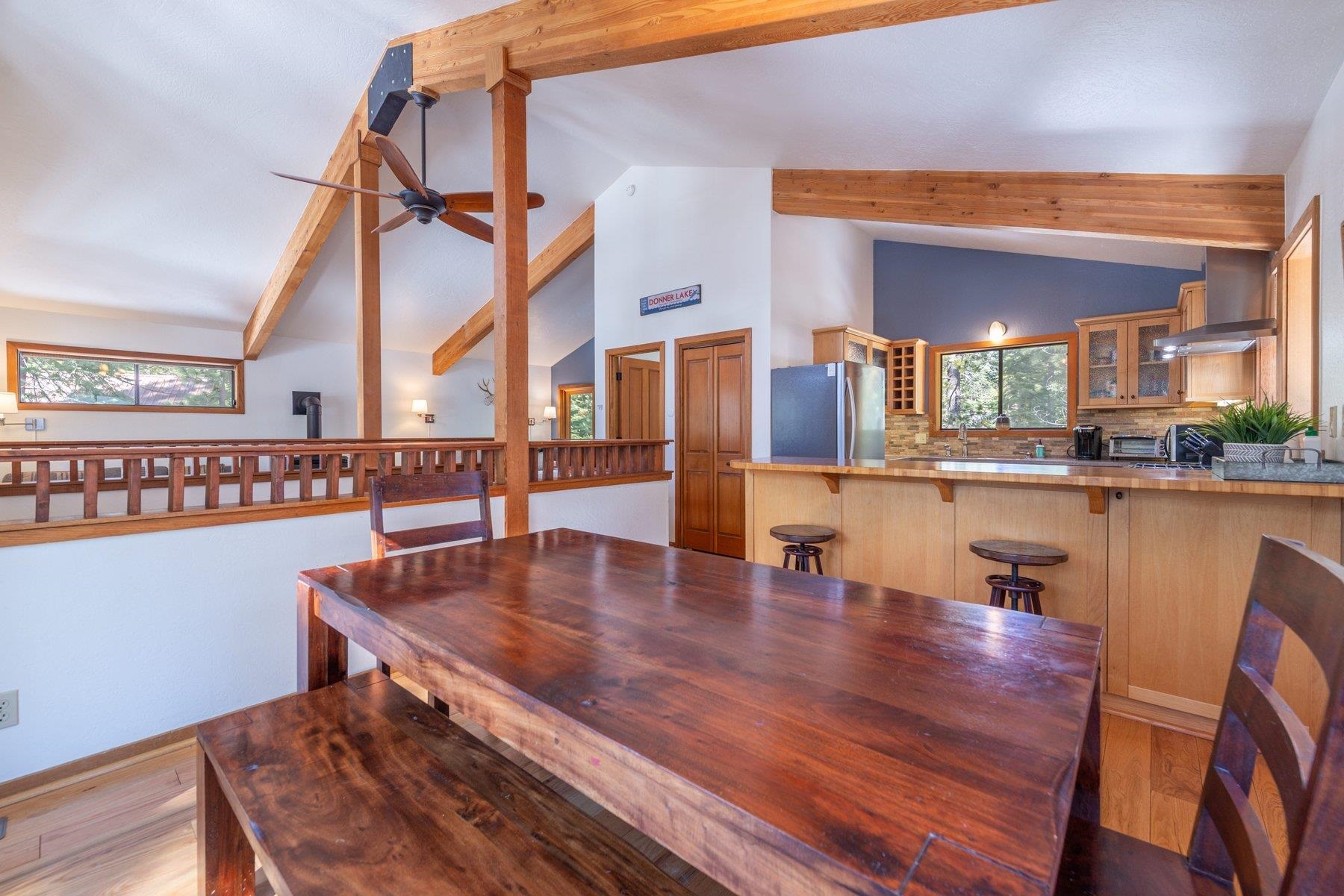 12317 Bennett Flat Road Truckee, CA 96161 - Photo 14 of 28 a dining hall with stainless steel appliances kitchen island granite countertop a stove and cabinets