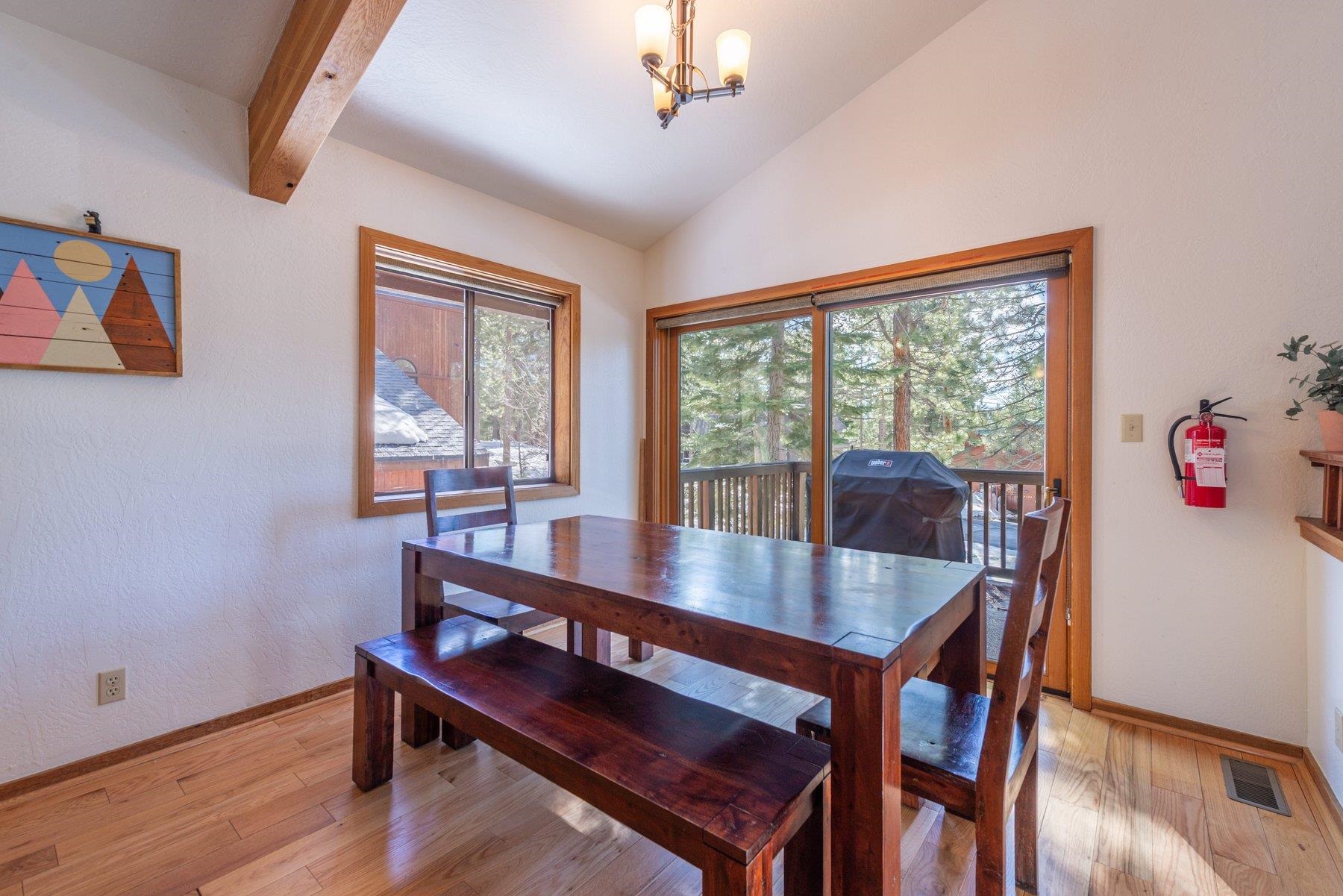 12317 Bennett Flat Road Truckee, CA 96161 - Photo 15 of 28 a view of a dining room with furniture window and wooden floor