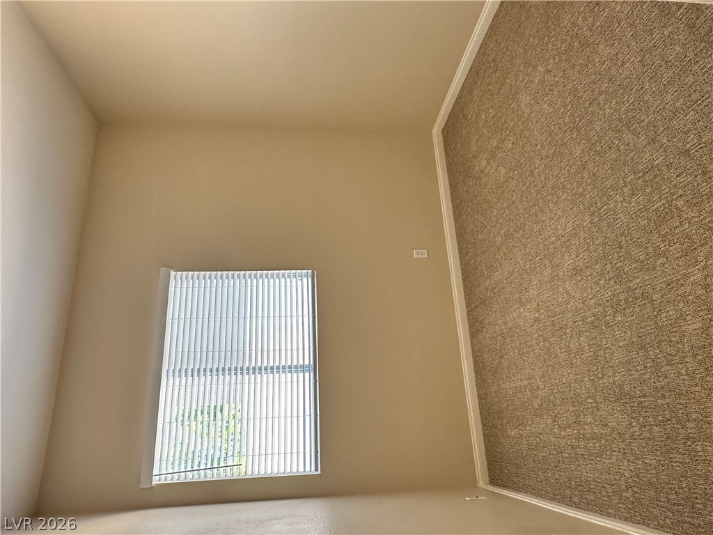 1922 Thunder Ridge Circle Henderson, NV 89012 - Photo 15 of 27 Well-lit interior space with plush carpeting, ready for personalized touches.
