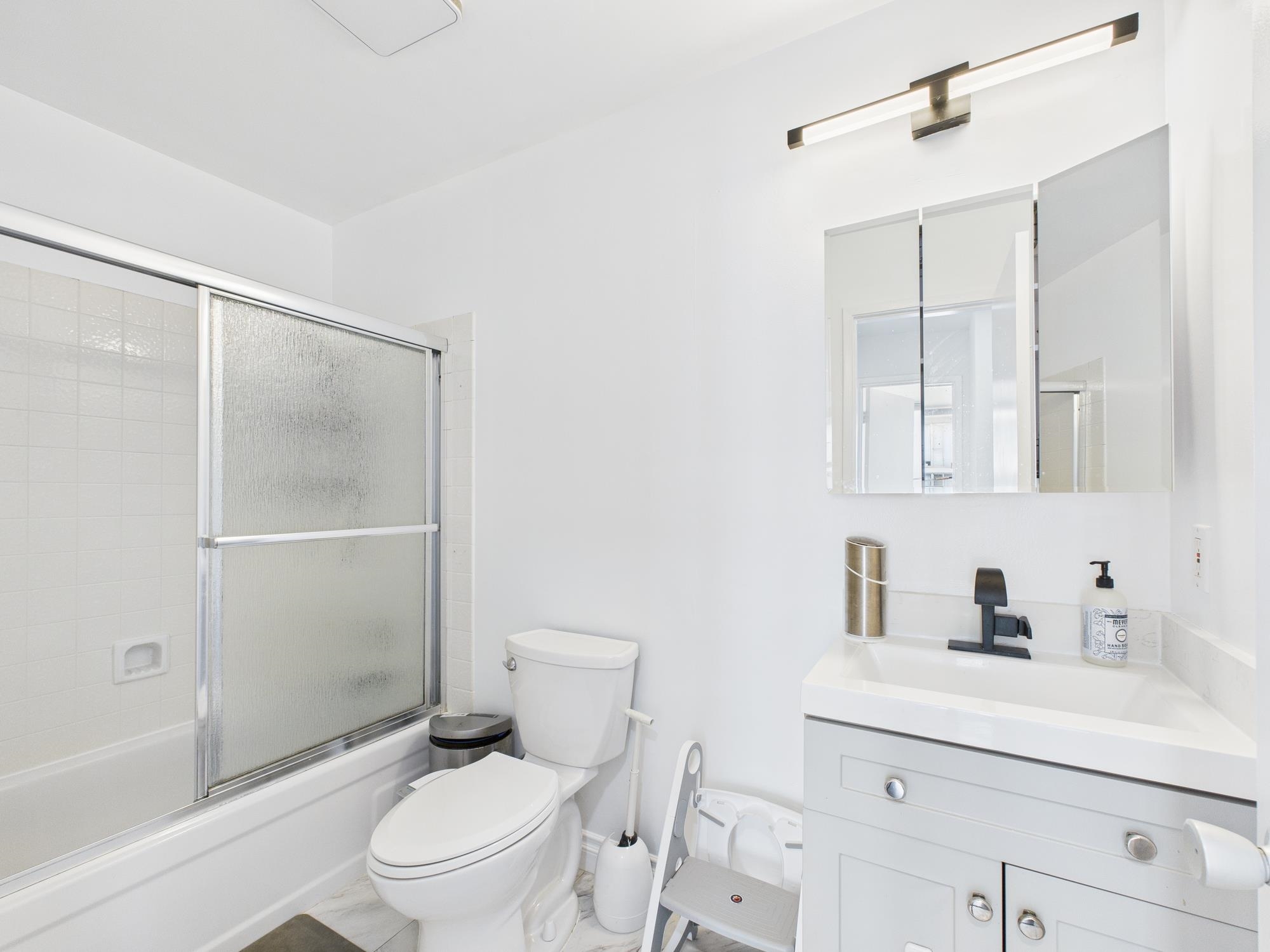 4099 Howe Street, Unit 202 Oakland, CA 94611 - Photo 15 of 19 Bathroom featuring vanity and enclosed tub / shower combo