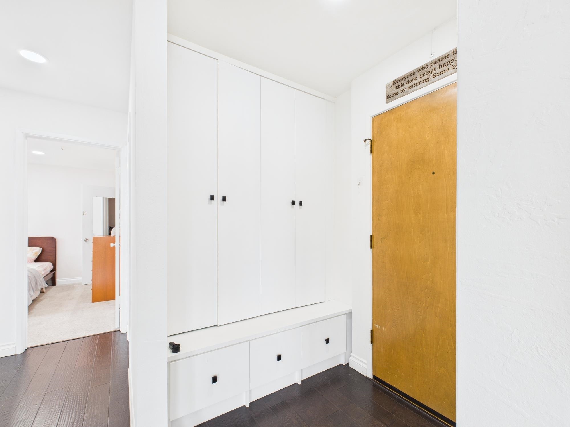 4099 Howe Street, Unit 202 Oakland, CA 94611 - Photo 2 of 19 Corridor featuring dark wood finished floors and baseboards