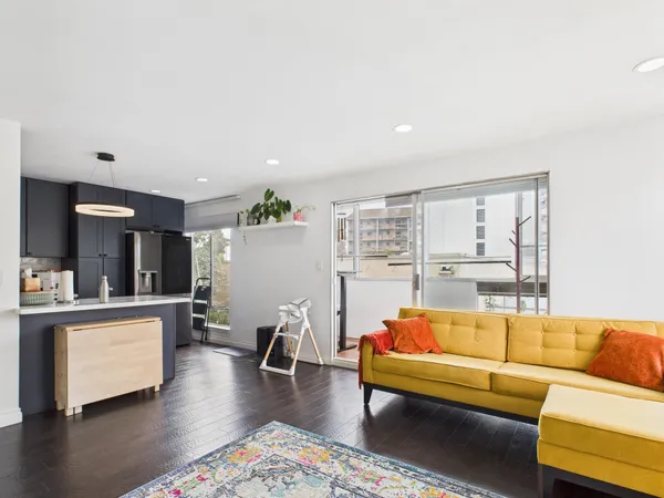 a living room with furniture and a table