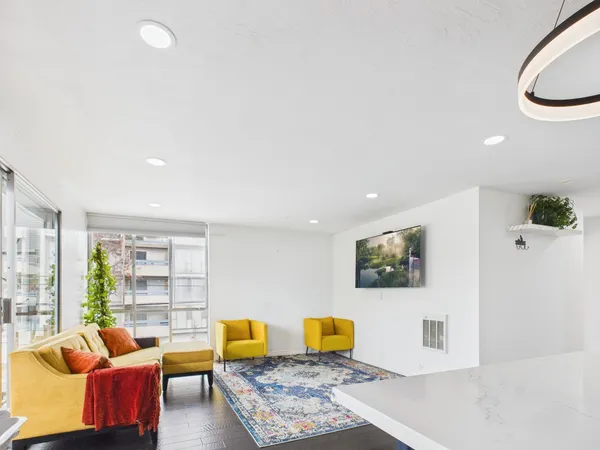 a living room with furniture and a rug