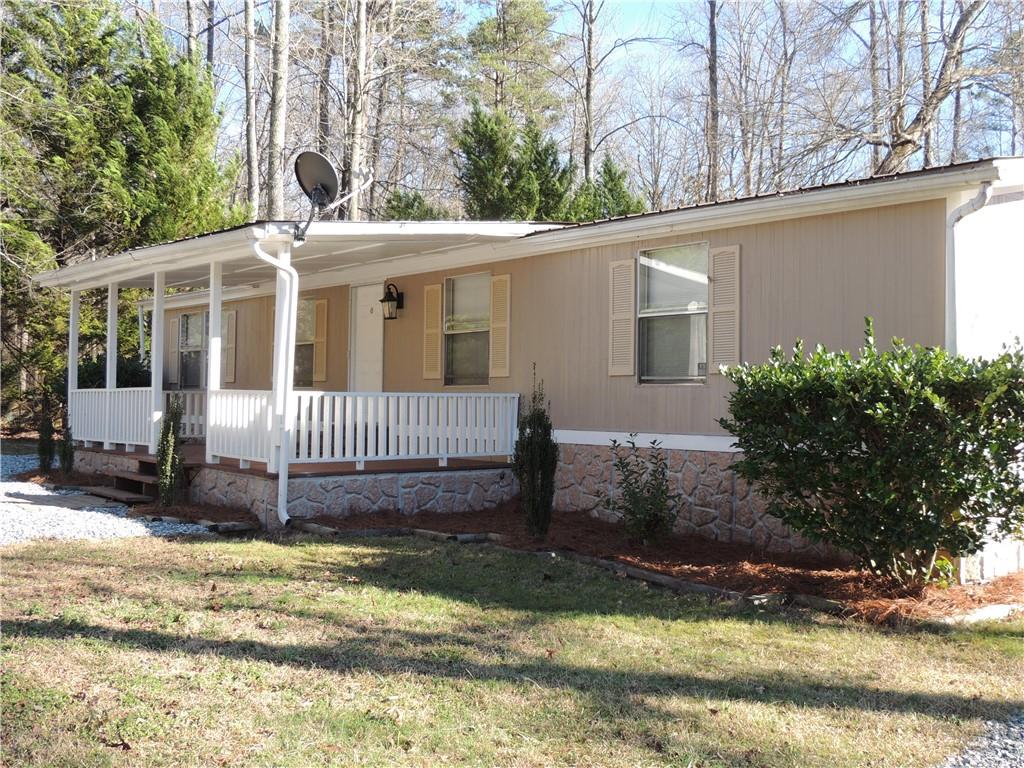 209 Horton Road Dahlonega, GA 30533 - Photo 23 of 41 a view of a house with a yard in a garden