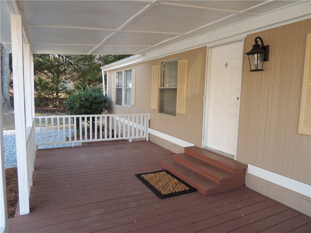 209 Horton Road Dahlonega, GA 30533 - Photo 27 of 41 a view of wooden floor and windows in the room