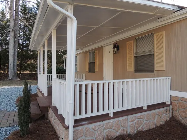 a view of porch with wooden floor
