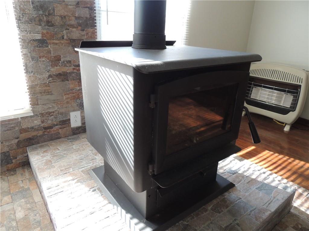 209 Horton Road Dahlonega, GA 30533 - Photo 30 of 41 a living room with a fireplace and a window