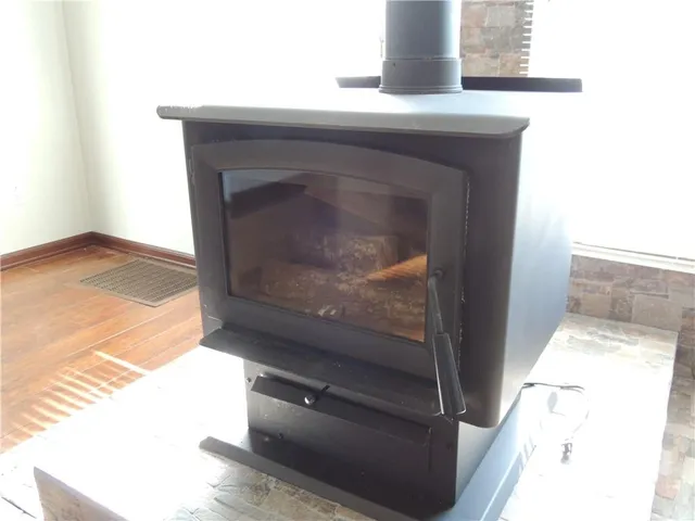 a kitchen with granite countertop a sink and a window