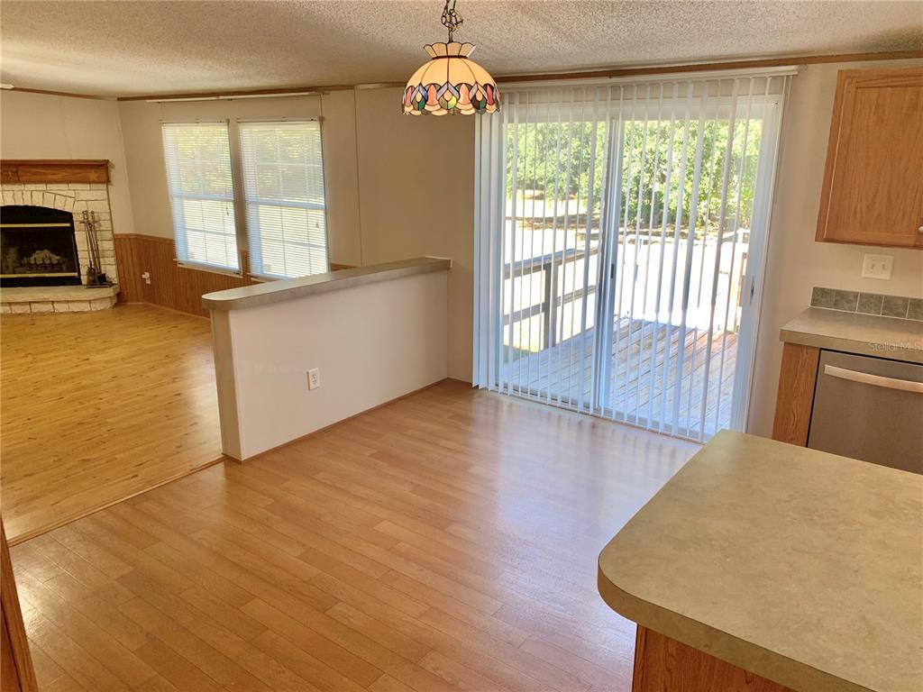12752 Southeast 9th Place Gainesville, FL 32641 - Photo 12 of 53 a view of a livingroom with furniture window and wooden floor