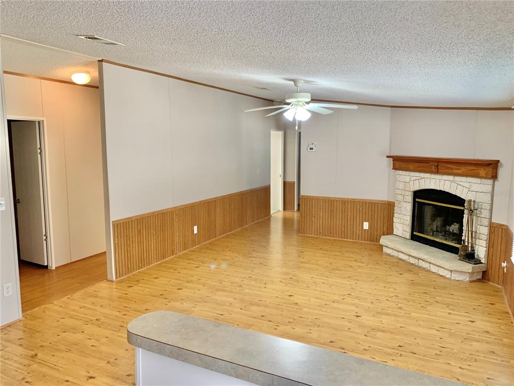 12752 Southeast 9th Place Gainesville, FL 32641 - Photo 19 of 53 a view of an empty room with a fireplace