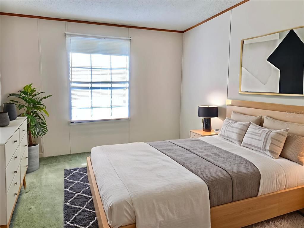 12752 Southeast 9th Place Gainesville, FL 32641 - Photo 34 of 53 a bedroom with a bed and a window