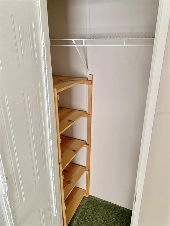 12752 Southeast 9th Place Gainesville, FL 32641 - Photo 36 of 53 a view of storage and utility room with racks on the wall