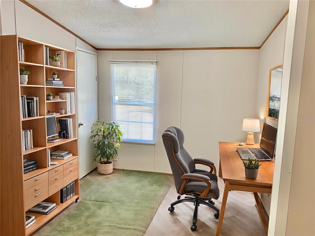 12752 Southeast 9th Place Gainesville, FL 32641 - Photo 40 of 53 a view of a workspace with furniture and a window