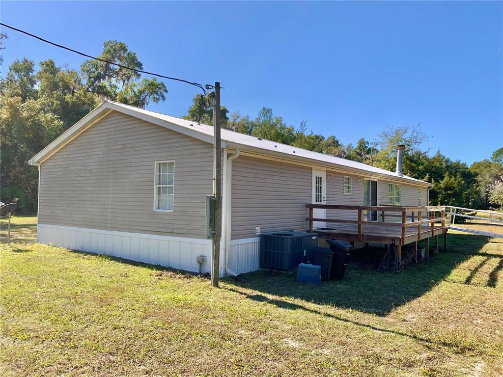12752 Southeast 9th Place Gainesville, FL 32641 - Photo 47 of 53 a backyard of a house with table and chairs