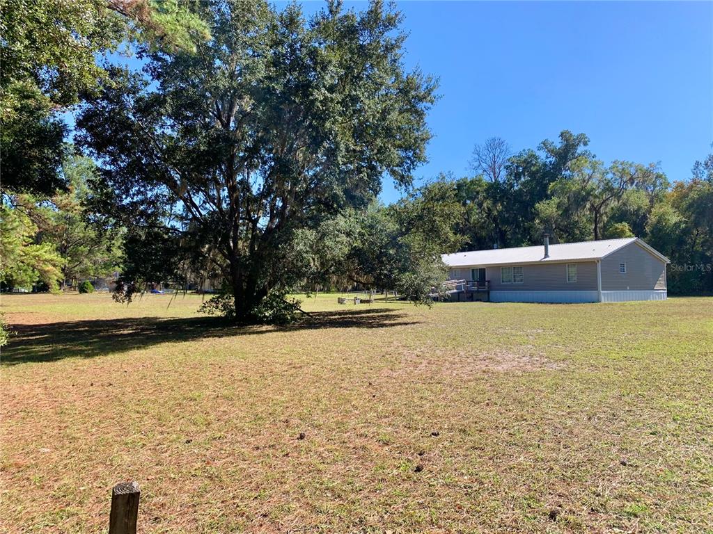 12752 Southeast 9th Place Gainesville, FL 32641 - Photo 49 of 53 a house view with swimming pool in front of it