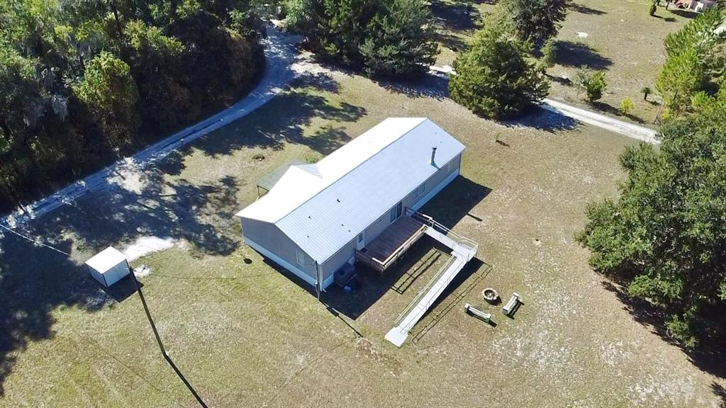 12752 Southeast 9th Place Gainesville, FL 32641 - Photo 50 of 53 an aerial view of a residential house with yard