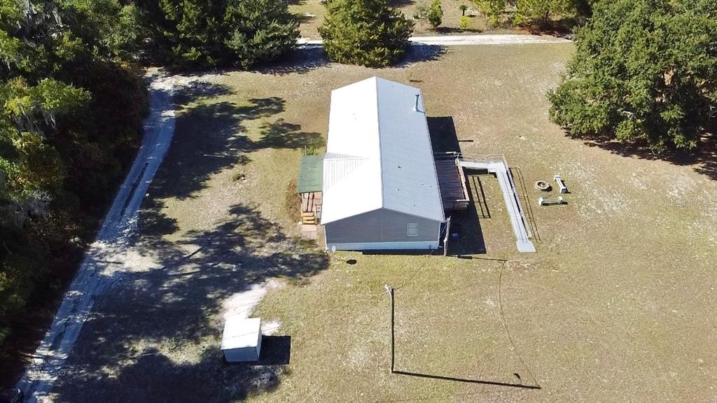 12752 Southeast 9th Place Gainesville, FL 32641 - Photo 51 of 53 a view of a house with a yard