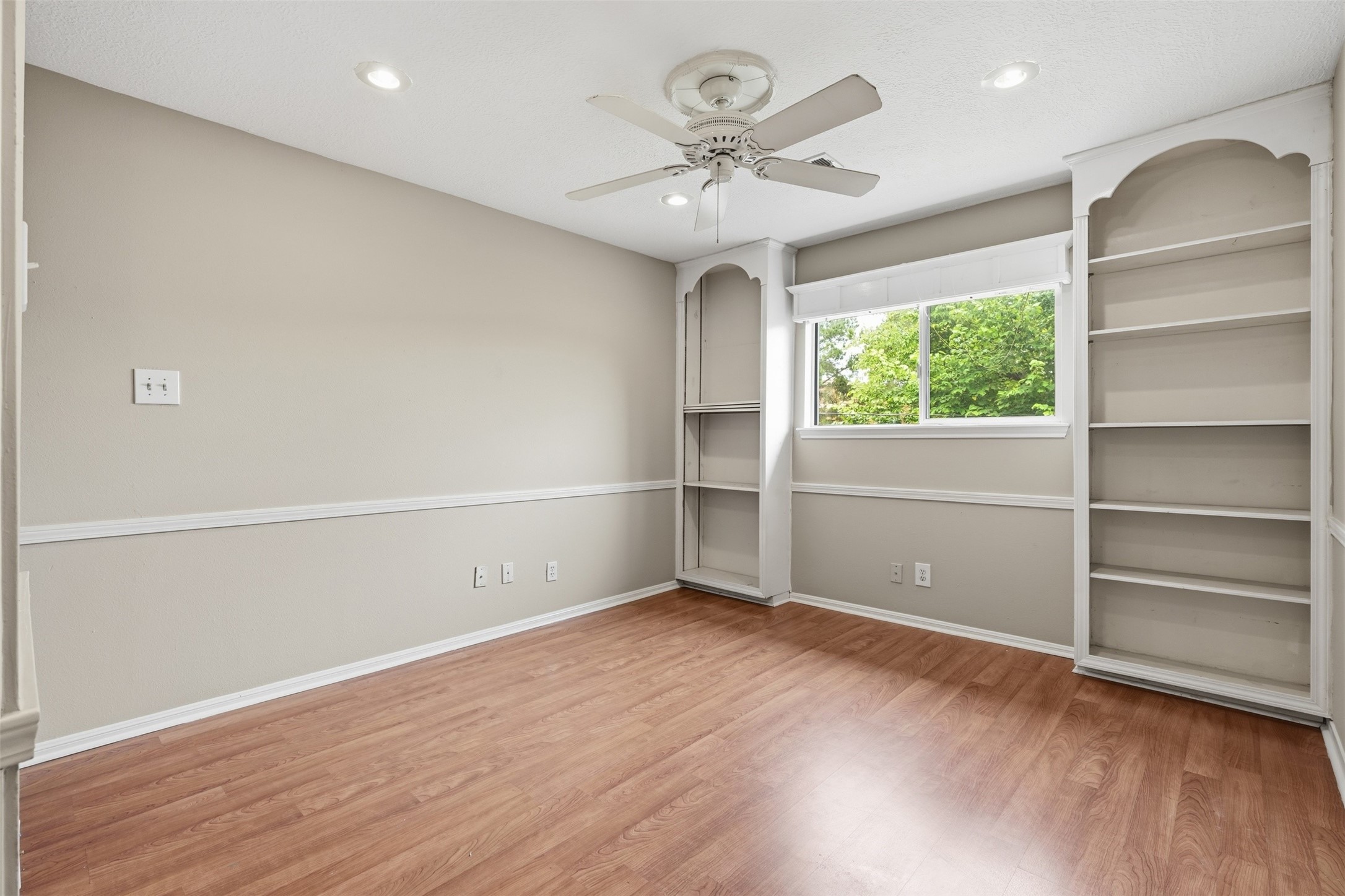 8310 Mentmore Drive Spring, TX 77379 - Photo 45 of 47 Bright and inviting secondary bedroom with generous proportions and convenient access to nearby bathrooms.