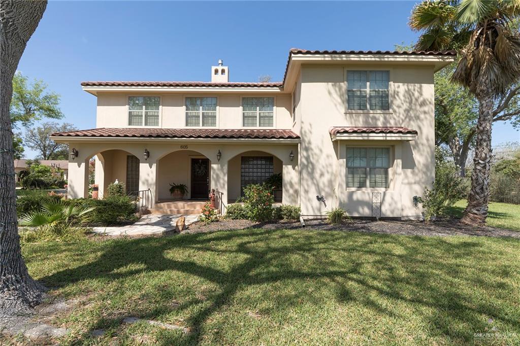 The home is finished with architectural features of Spanish Colonial Revival, Mediterranean and Mission Revival styles. The clay roof, earthen toned stucco finish and arches are a few key variations of these design aesthetics.