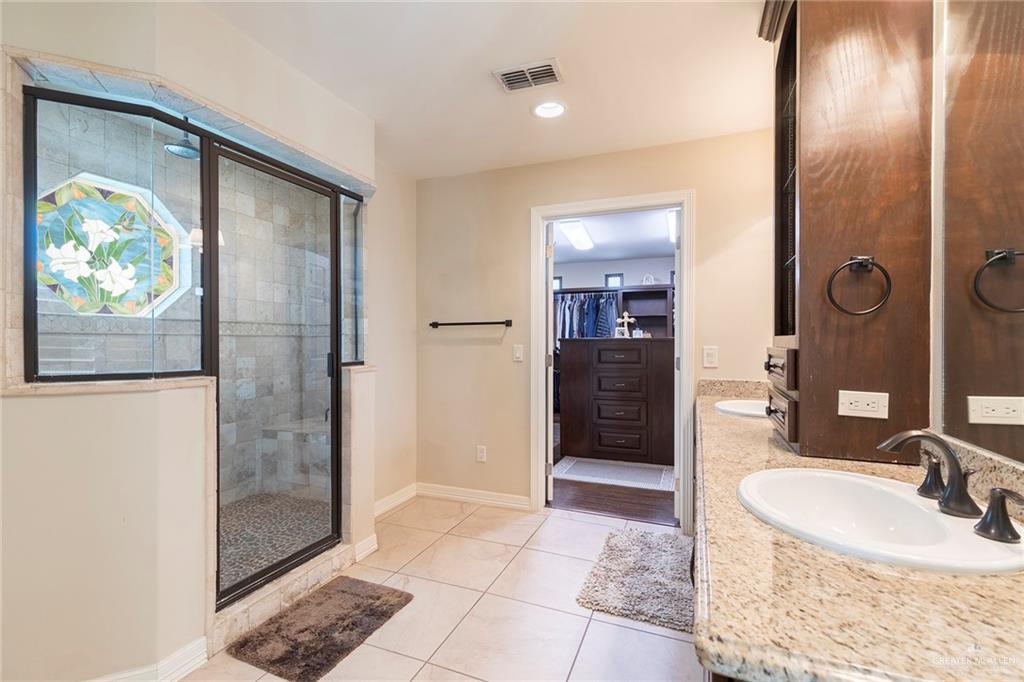 605 South Hutto Road Donna, TX 78537 - Photo 13 of 45 An amazing custom stain glass window is the crown-jewel of the large walk-in shower.