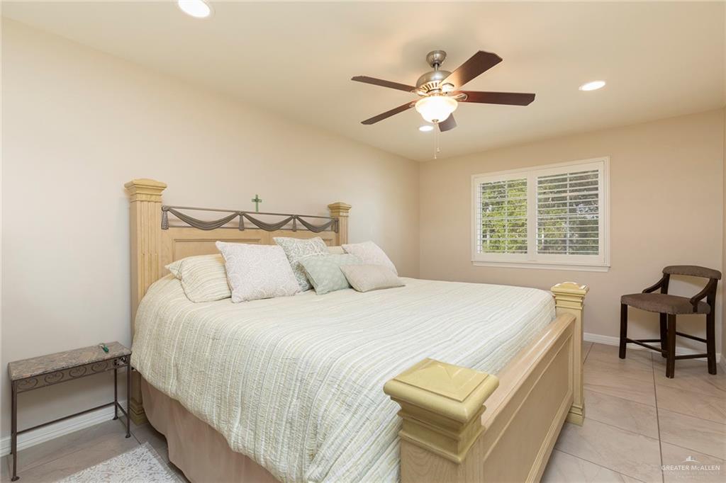 605 South Hutto Road Donna, TX 78537 - Photo 15 of 45 In addition to the upstairs master bedroom the home houses an additional two bedrooms on the second floor. Each bedroom is complete with its own private ensuite. The larger bedroom houses a king-sized bed.
