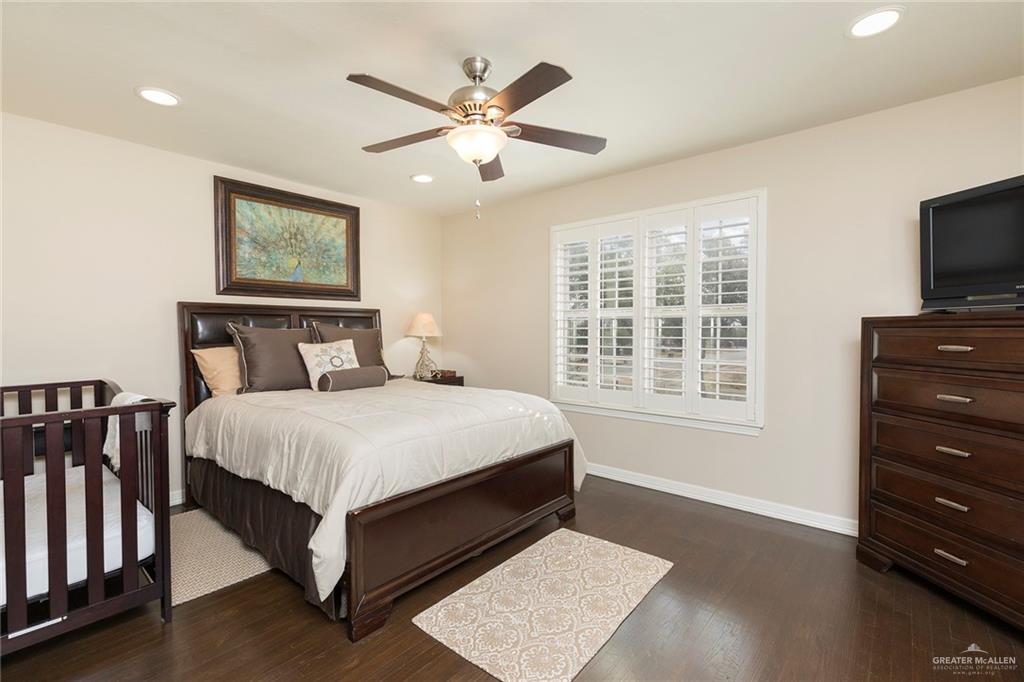 605 South Hutto Road Donna, TX 78537 - Photo 16 of 45 a bedroom with a large bed and a tv