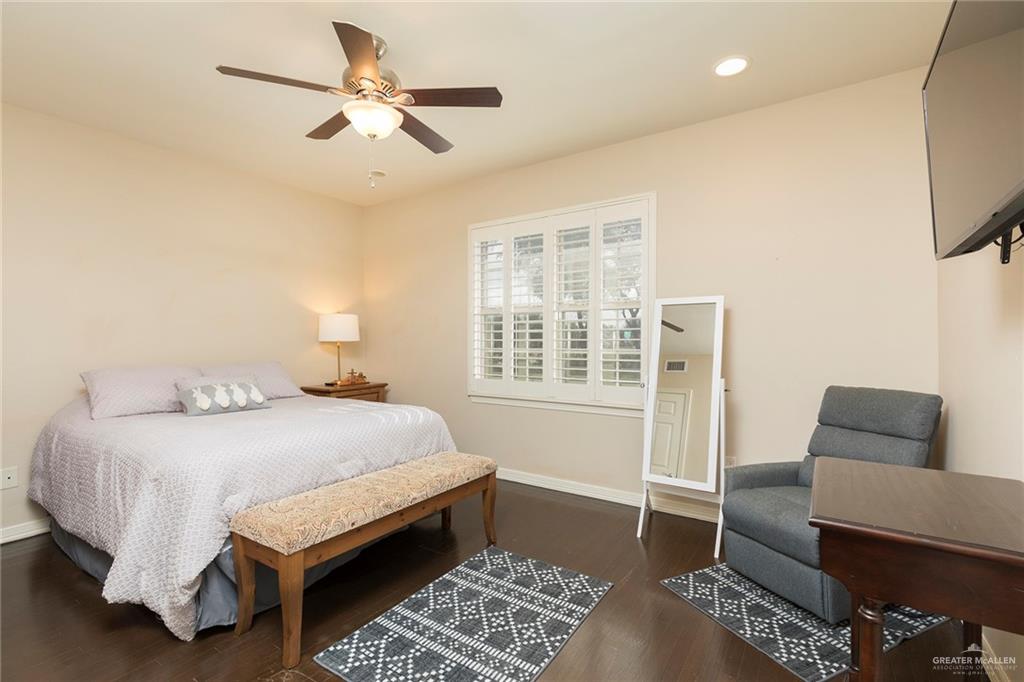 605 South Hutto Road Donna, TX 78537 - Photo 16 of 45 The third bedroom on the second-floor features a queen-sized bed and a private ensuite. The oversized window faces east for optimal morning light.