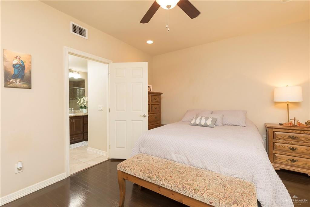 605 South Hutto Road Donna, TX 78537 - Photo 21 of 45 a bedroom with a bed and dresser