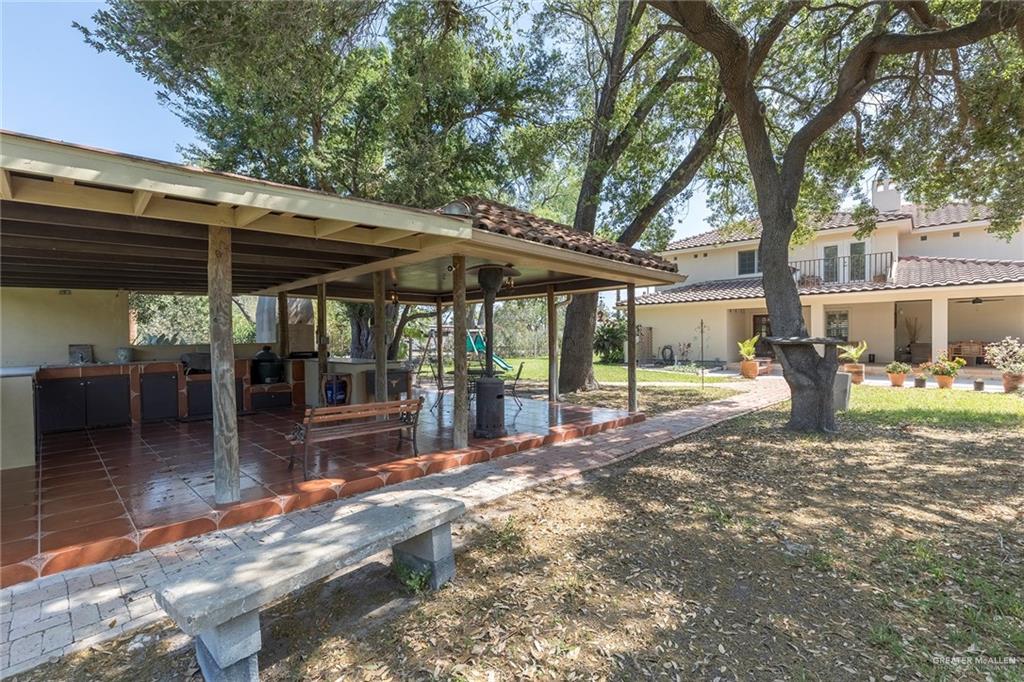 605 South Hutto Road Donna, TX 78537 - Photo 23 of 45 The expansive covered outdoor kitchen is the ideal spot for bar-b-queuing with family and friends.