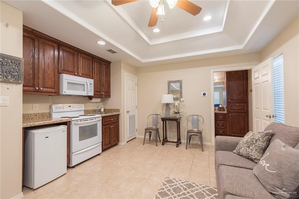 605 South Hutto Road Donna, TX 78537 - Photo 25 of 45 This detached guest quarter features a kitchenette, sleeper sofa, and an ensuite.