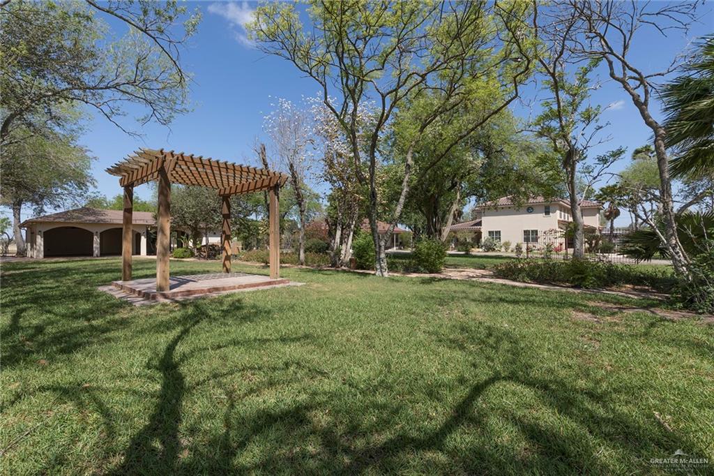 605 South Hutto Road Donna, TX 78537 - Photo 38 of 45 A pergola sits in the center of the dedicated Hummingbird Springs yard.