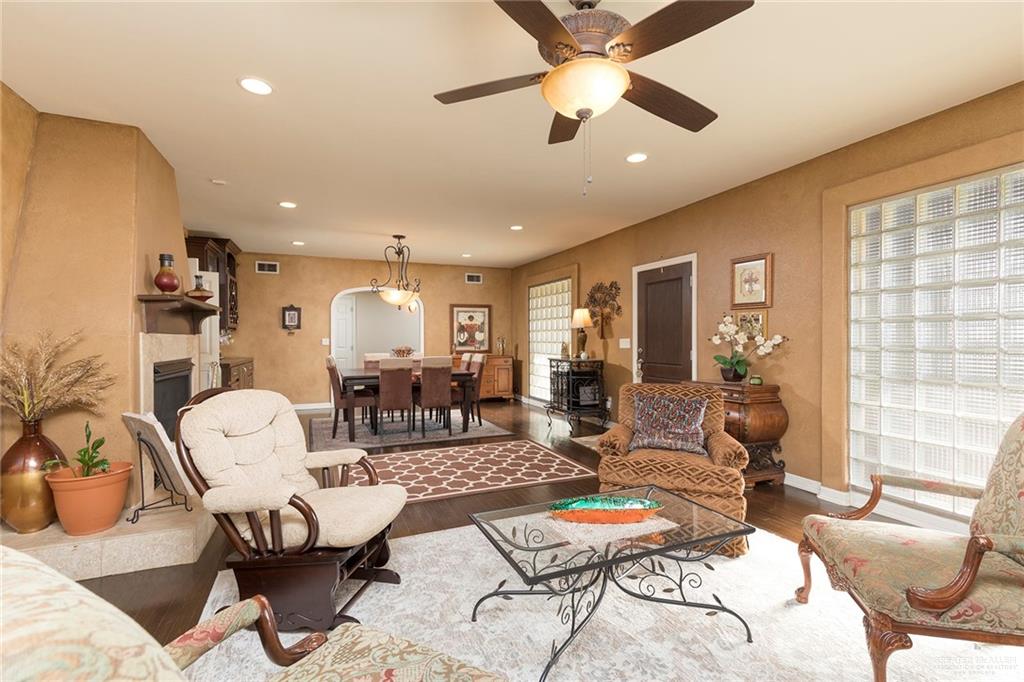 605 South Hutto Road Donna, TX 78537 - Photo 4 of 45 The front entrance opens up to formal living and dining rooms. Rich dark wood floors contrast nicely with the lighter walls.