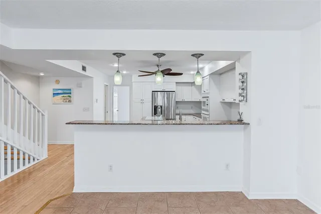 a view of an empty room with a balcony