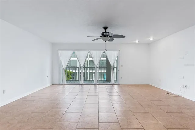 a view of a livingroom with a hall and wooden floor