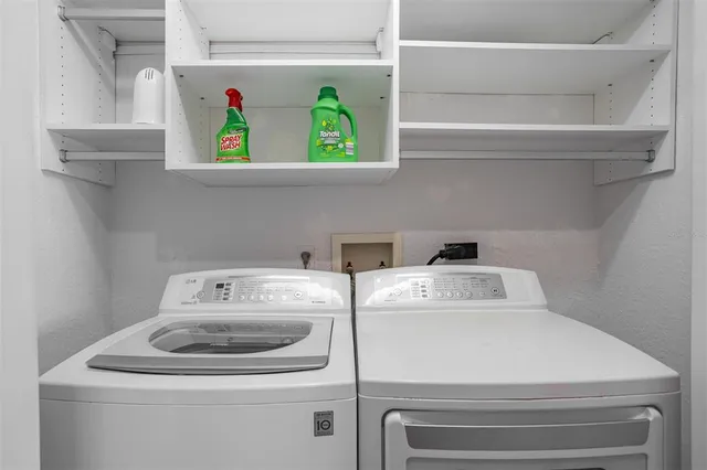 a view of a hallway with wooden door